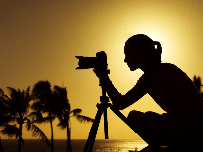 silhouette of a female photographer
